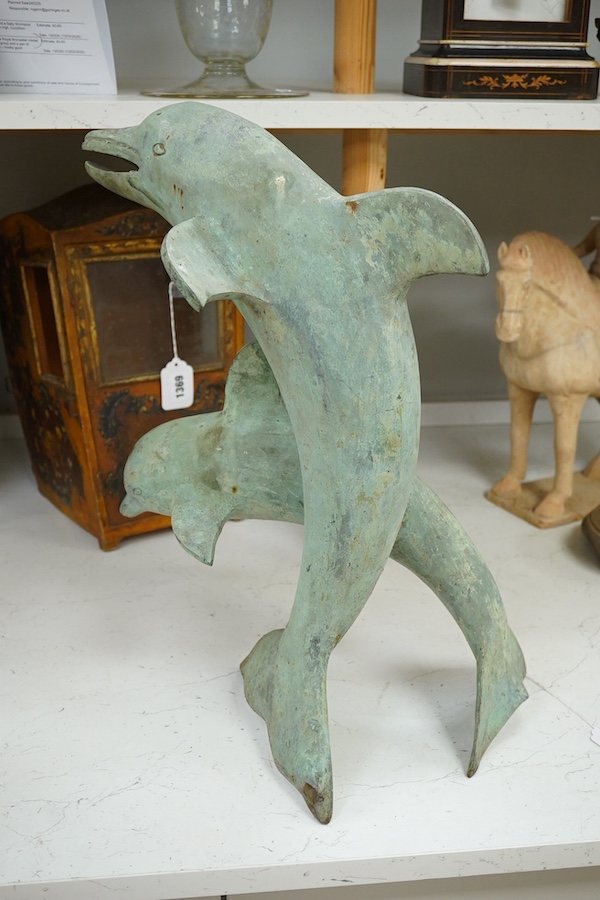 A patinated bronze dolphin group, 49cm high. Condition - some foxing to surface